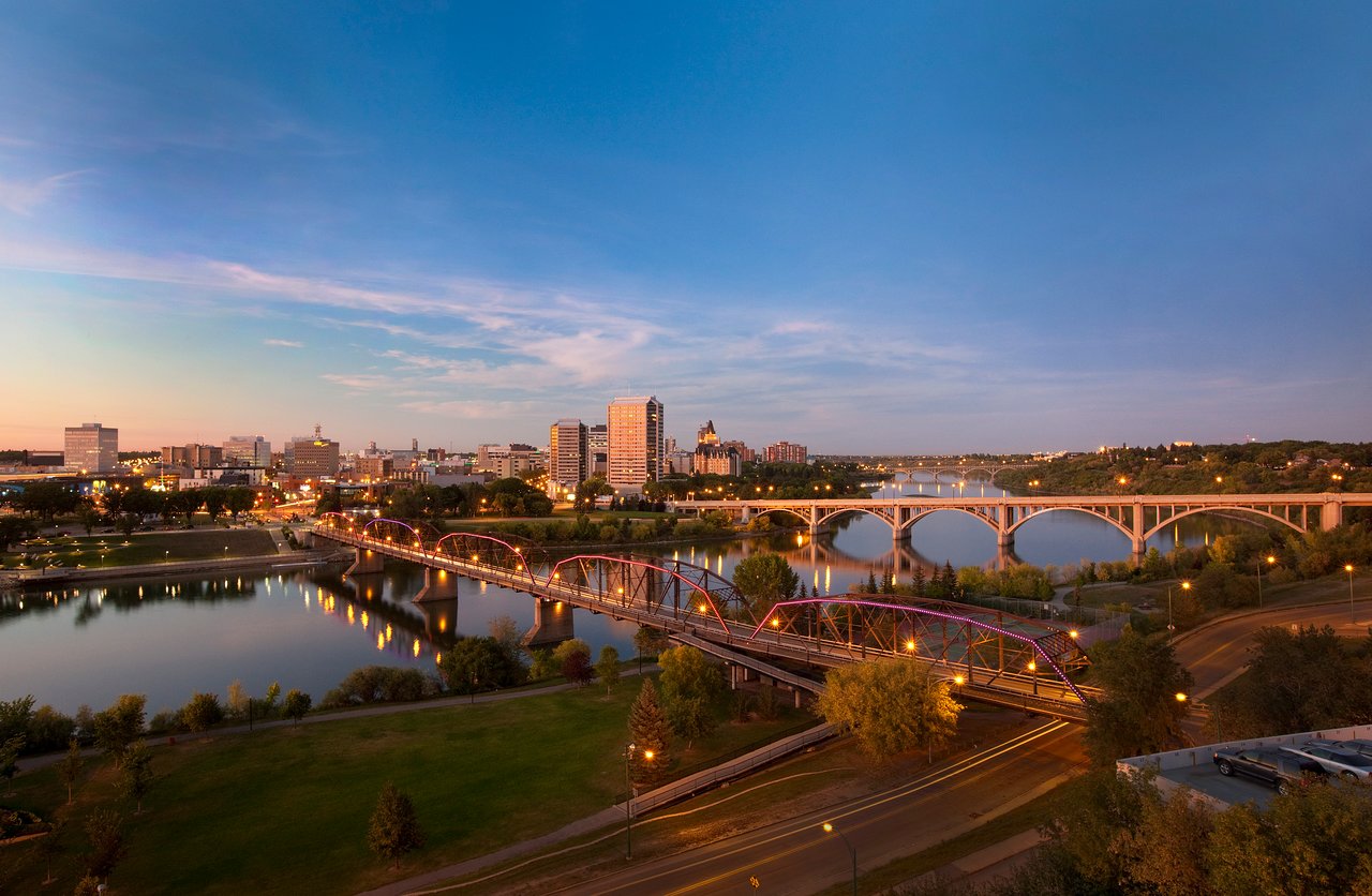 Saskatoon skyline at dusk over the South Saskatchewan River